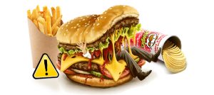 mans legs inside fast food like burger and pringles and french fries