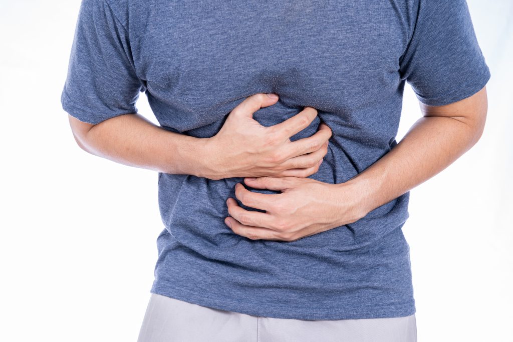 man suffering from stomach pain